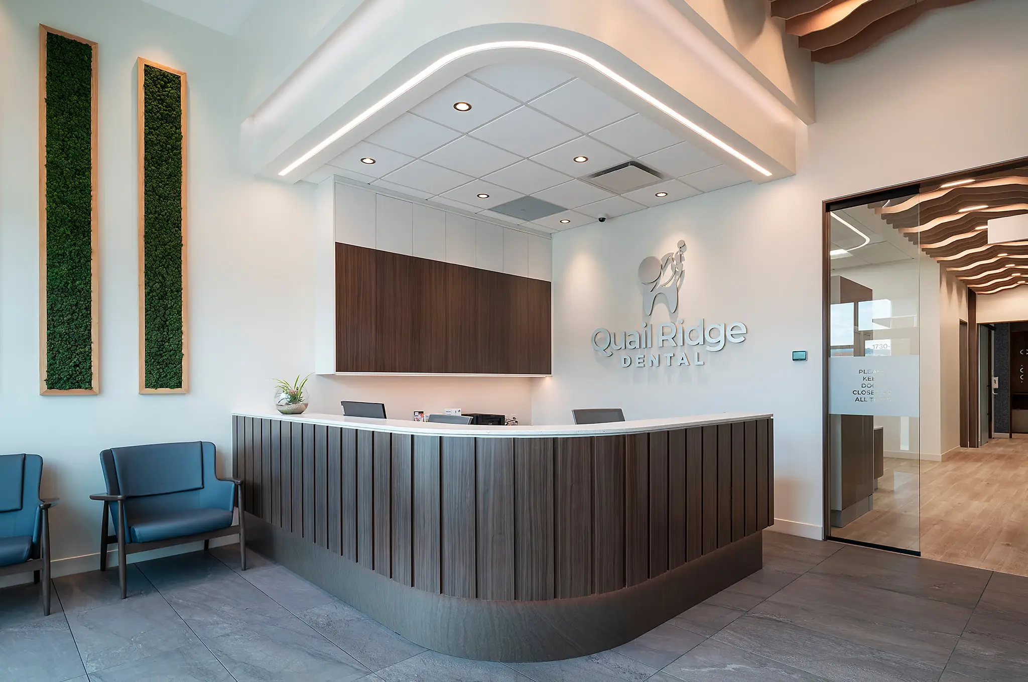 Curved wood reception counter at Quail Ridge Dental, built by Chriscan Construction